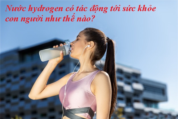 Woman With Ponytail Is Drinking From Sportive Bottle Earphones Near Modern Building 8353 10205